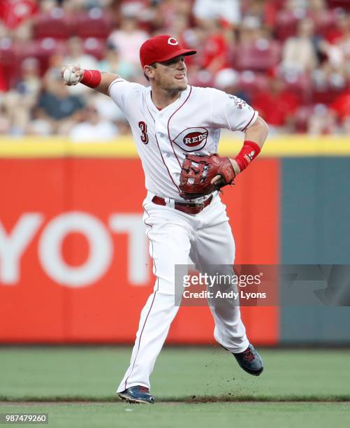 Scooter Gennett of the Milwaukee Brewers throws the ball to first base against the Cincinnati Reds at Great American Ball Park on June 29, 2018 in...