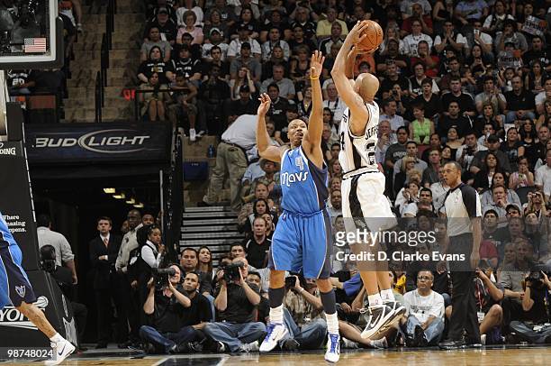 Richard Jefferson of the San Antonio Spurs shoots the outside jump shot against Caron Butler of the Dallas Mavericks in Game Three of the Western...