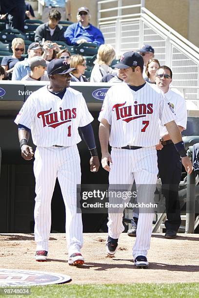 Orlando Hudson and Joe Mauer of the Minnesota Twins come out for their 2009 Golden Glove Awards in a pre-game ceremony before the game against the...