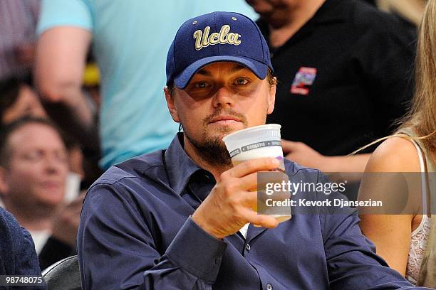 Actor Leonardo DiCaprio sits courtside during Game Five of the Western Conference Quarterfinals of the 2010 NBA Playoffs between the Los Angeles...