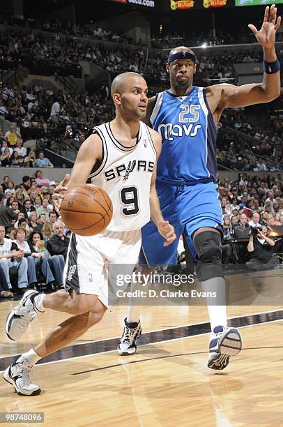Tony Parker of the San Antonio Spurs dribble drives baseline against Erick Dampier the Dallas Mavericks in Game Three of the Western Conference...