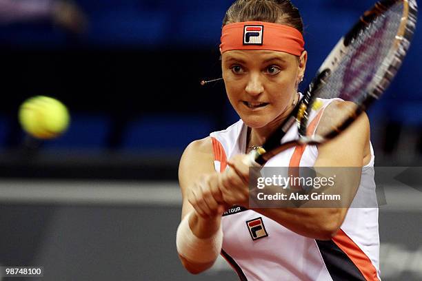 Agnes Szavay of Hungary plays a backhand during her second round match against Dinara Safina of Russia at day four of the WTA Porsche Tennis Grand...