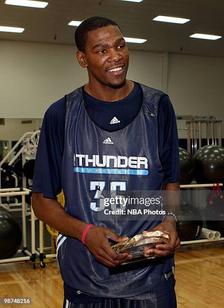 Kevin Durant of the Oklahoma City Thunder is presented the Kia Performance Award for NBA Player of the Month by Harrison J Jones ll at Thunder...