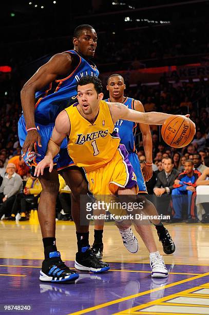 Jordan Farmar of the Los Angeles Lakers drives by Serge Ibaka of the Oklahoma City Thunder during Game Five of the Western Conference Quarterfinals...