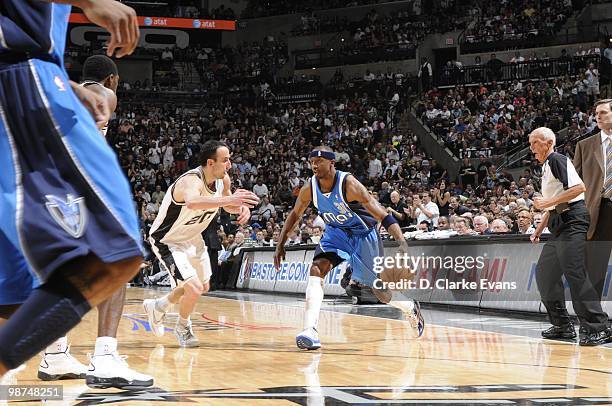 Jason Terry of the Dallas Mavericks dribbles the ball against Manu Ginobili of the San Antonio Spurs in Game Three of the Western Conference...