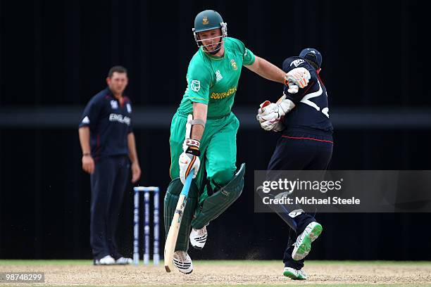 Graeme Smith of South Africa collides with England wicketkeeper Craig Kieswetter during the ICC T20 World Cup warm up match between South Africa and...