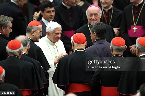 Pope Benedict XVI greets cardinals at the end of a concert at the Paul VI hall held for the fifth anniversary of his pontificate on April 29, 2010 in...