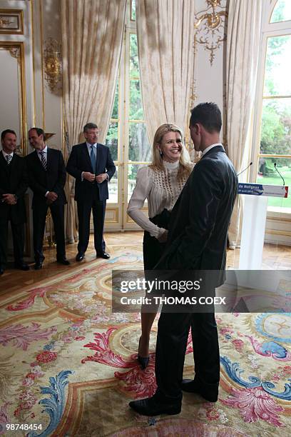 German Formula 1 pilot, Michael Schumacher chats with his wife Corinna after he was awarded with the French Legion of Honor by French Prime Minister...