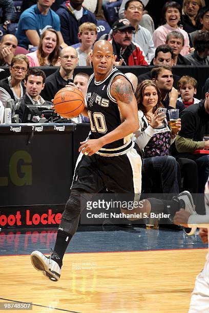 Keith Bogans of the San Antonio Spurs moves the ball up court during the game against the New Jersey Nets at the IZOD Center on March 29, 2010 in...