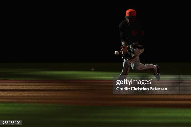Austin Jackson of the San Francisco Giants warms up on the infield before MLB game against the Arizona Diamondbacks at Chase Field on June 29, 2018...