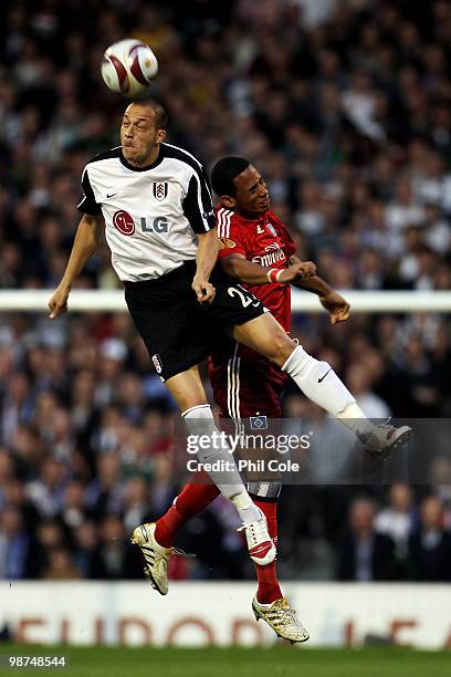 Bobby Zamora of Fulham and Dennis Aogo of Hamburg battle for the header during the UEFA Europa League Semi-Final 2nd leg match between Fulham and...