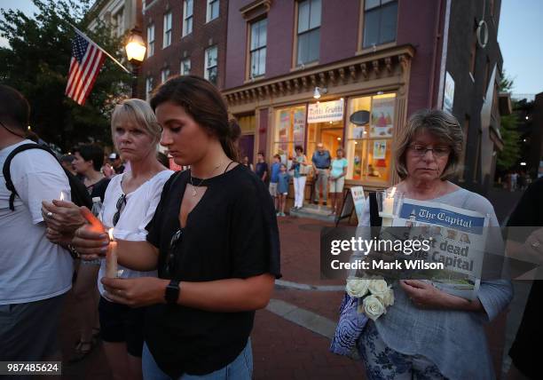 People line up on both sides of Main St. During a candlelight vigil to honor the 5 people were shot and killed at the Capital Gazette newpaper...