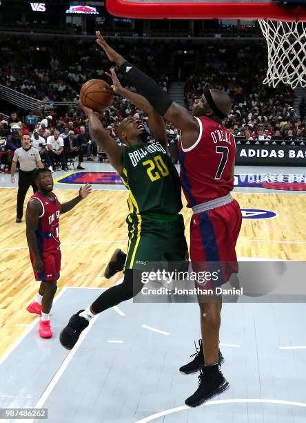 Andre Owens of Ball Hogs shoots against Jermain O'Neal of Tri State during week two of the BIG3 three on three basketball league at United Center on...