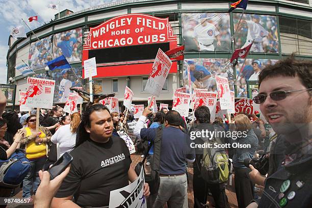 Immigrant rights supporters rally outside Wrigley Field before the start of the Cubs' game against the Arizona Diamondbacks April 29, 2010 in...