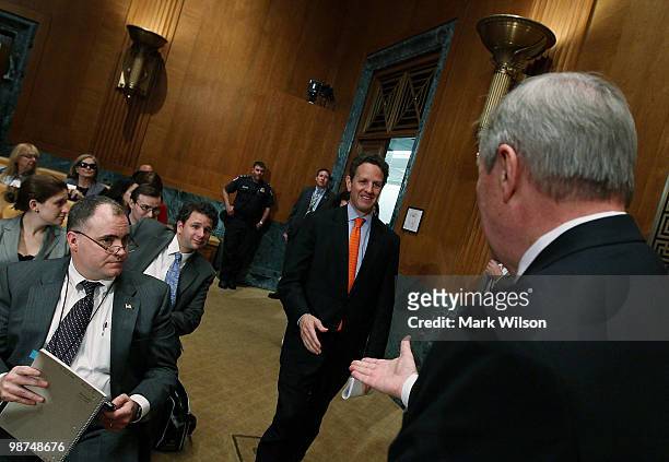 Treasury Secretary Timothy Geithner walks up to shake hands with Chairman Richard Durbin before the start of a Financial Services and General...