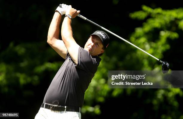 Phil Mickelson watches his tee shot on the 5th hole during the first round of the Quail Hollow Championship at Quail Hollow Country Club on April 29,...