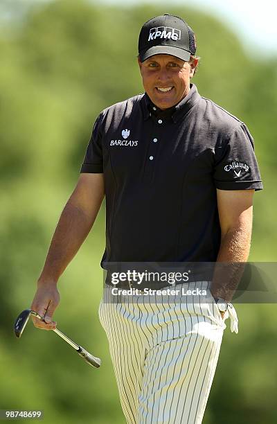 Phil Mickelson smiles on the 9th hole during the first round of the Quail Hollow Championship at Quail Hollow Country Club on April 29, 2010 in...