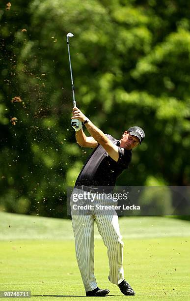 Phil Mickelson watches a shot on the 9th hole during the first round of the Quail Hollow Championship at Quail Hollow Country Club on April 29, 2010...