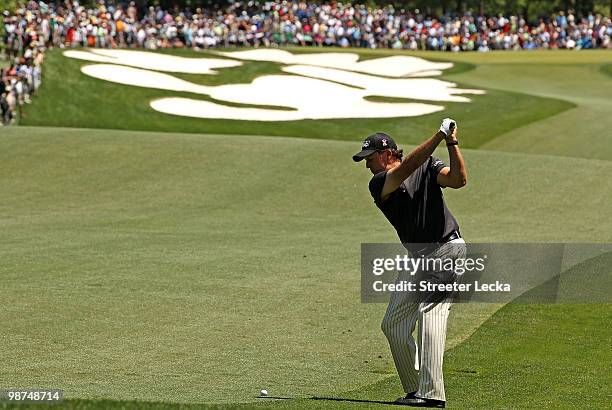 Phil Mickelson hits his second shot on the 5th hole during the first round of the Quail Hollow Championship at Quail Hollow Country Club on April 29,...