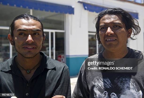 Mexican social activists David Venegas and Noe Bautista speak to the press after their arrival in Santiago Juxtlahuaca, Mexico on April 29, 2010....