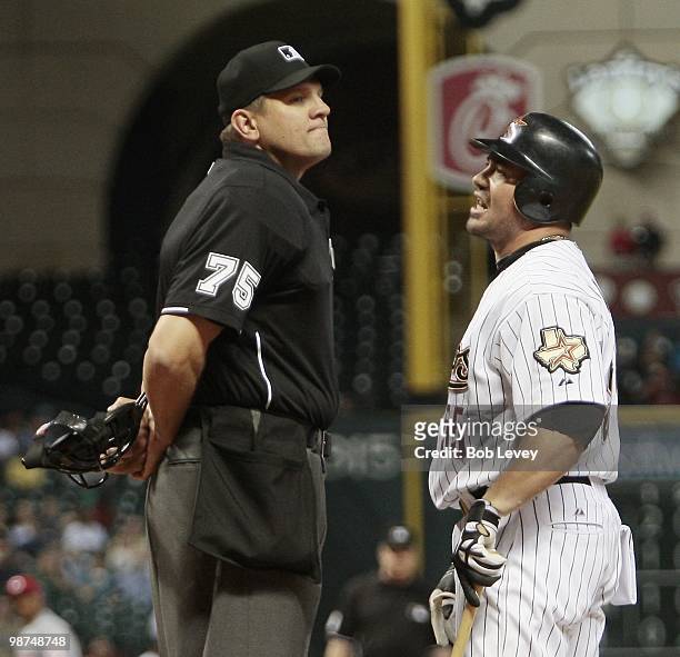 Humberto Quintero of the Houston Astros argues with home plate umpire Chad Fairchild after he was called out on what he thought was a foul ball as...