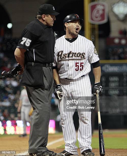 Humberto Quintero of the Houston Astros argues with home plate umpire Chad Fairchild after he was called out on what he thought was a foul ball as...