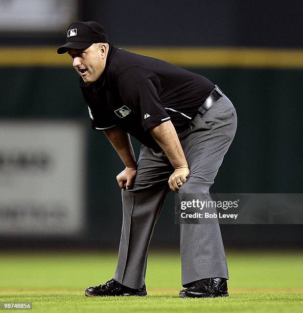 Second base umpire Eric Cooper during a baseball game between the Cincinnati Reds and Houston Astros at Minute Maid Park on April 28, 2010 in...