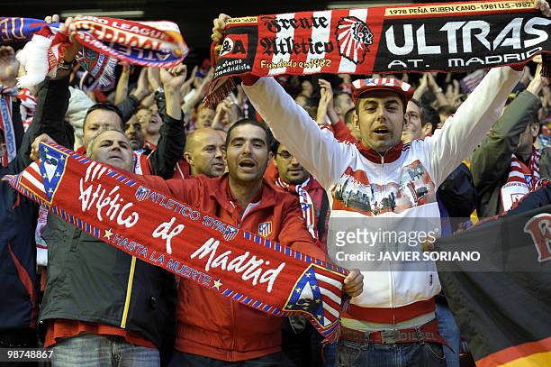Atletico Madrid fans prepare for kick off before their UEFA Europa League semifinal second leg football match against Atletico Madrid on April 29,...