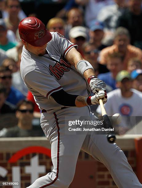 Chris Snyder of the Arizona Diamondbacks hits a two-run home run in the 4th inning against the Chicago Cubs at Wrigley Field on April 29, 2010 in...