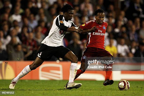 Dickson Etuhu of Fulham tackles Ze Roberto of Hamburg during the UEFA Europa League Semi-Final 2nd leg match between Fulham and Hamburger SV at...