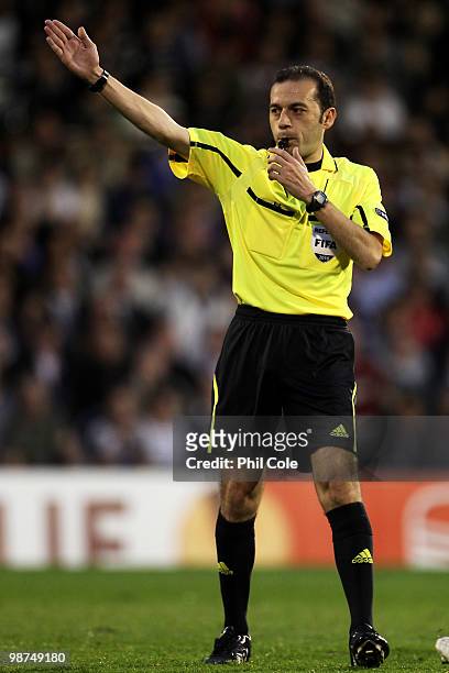 Referee Cuneyt Cakir makes a decision during the UEFA Europa League Semi-Final 2nd leg match between Fulham and Hamburger SV at Craven Cottage on...