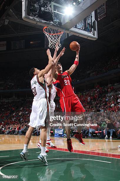 Zaza Pachulia of the Atlanta Hawks lays up a shot against Dan Gadzuric of the Milwaukee Bucks in Game Three of the Eastern Conference Quarterfinals...