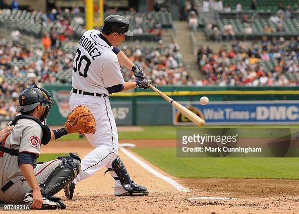 Magglio Ordonez of the Detroit Tigers gets his 2,000 career hit in the fourth inning, a single off of Carl Pavano of the Minnesota Twins, at Comerica...