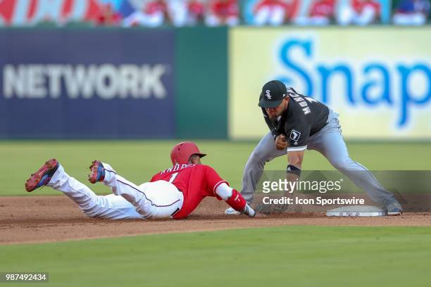 Chicago White Sox Second base Yoan Moncada tags out Texas Rangers Shortstop Elvis Andrus during the game between the Chicago White Sox and Texas...