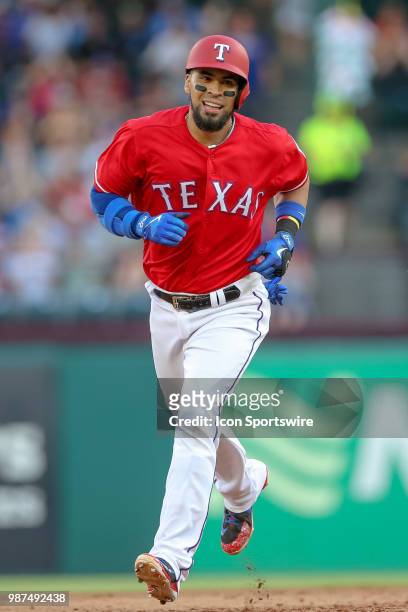 Texas Rangers Catcher Robinson Chirinos circles the bases after hitting a home run during the game between the Chicago White Sox and Texas Rangers on...