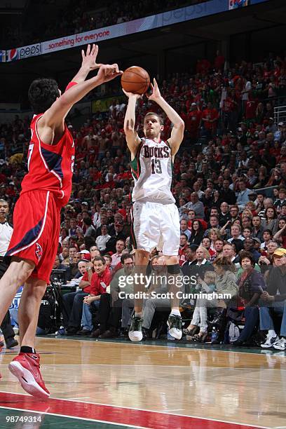 Luke Ridnour of the Milwaukee Bucks shoots the outside jump shot against the Atlanta Hawks in Game Three of the Eastern Conference Quarterfinals...