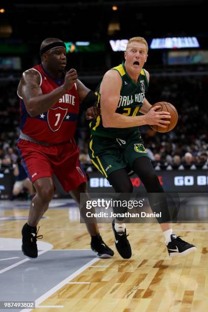 Jermain O'Neal of Tri State guards Brian Scalbrine of Ball Hogs during week two of the BIG3 three on three basketball league at United Center on June...