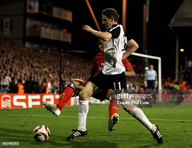 Zoltan Gera of Fulham is tackled by Jerome Boateng of Hamburg during the UEFA Europa League Semi-Final 2nd leg match between Fulham and Hamburger SV...