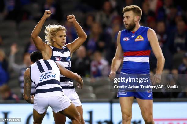 Debutant, Quinton Narkle of the Cats celebrates his first AFL goal with Tim Kelly of the Cats during the 2018 AFL round 15 match between the Western...