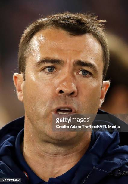 Chris Scott, Senior Coach of the Cats addresses his players during the 2018 AFL round 15 match between the Western Bulldogs and the Geelong Cats at...
