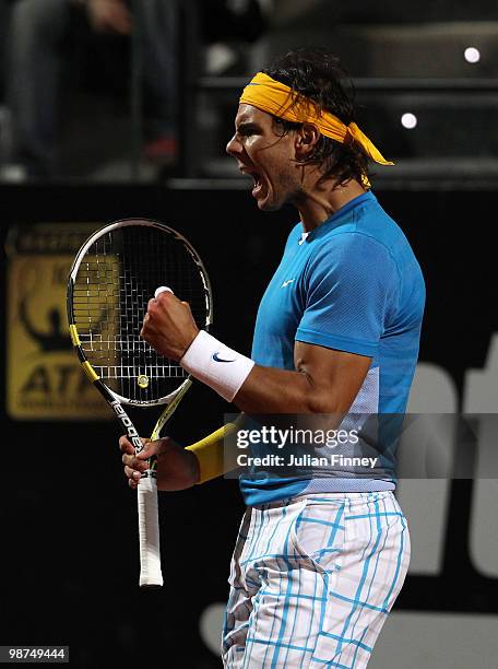 Rafael Nadal of Spain celebrates winning a game against Victor Hanescu of Romania during day five of the ATP Masters Series - Rome at the Foro...