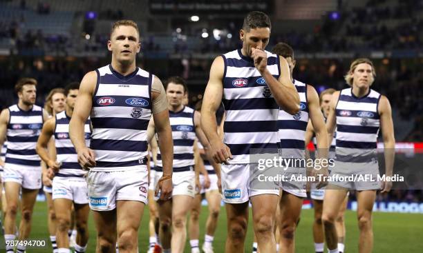 Joel Selwood and Harry Taylor of the Cats look dejected after a loss during the 2018 AFL round 15 match between the Western Bulldogs and the Geelong...