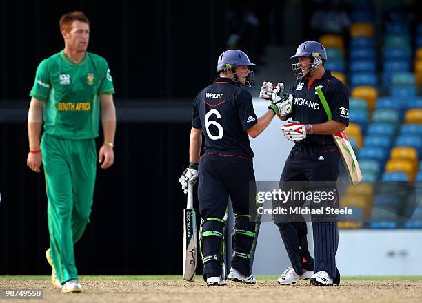 Luke Wright celebrates hitting the winning runs with Tim Bresnan off the bowling of Rusty Theron during the ICC T20 World Cup warm up match between...