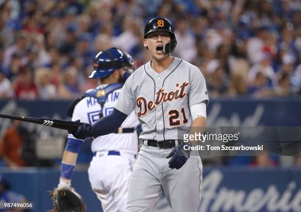 JaCoby Jones of the Detroit Tigers reacts after striking out in the eighth inning during MLB game action against the Toronto Blue Jays at Rogers...
