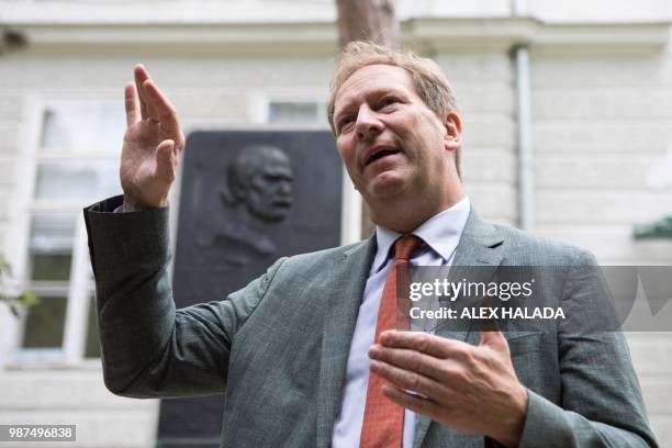 Bernhard Kuenburg, president of the Semmelweis Foundation, gestures during an interview in front of a commemorative plaque for pioneering scientist...