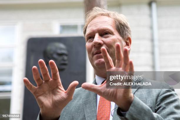 Bernhard Kuenburg, president of the Semmelweis Foundation, gestures during an interview in front of a commemorative plaque for pioneering scientist...