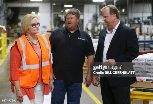 Senator Claire McCaskill , , tours the Mid Continent Nail Corporation plant that has been closed, with Chris Pratt , CFO, and Vice President of...