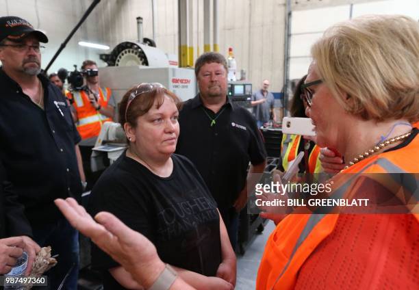 Senator Claire McCaskill , speaks to Mid Continent Nail Corporation employees after reports that customers have stopped placing orders in favor of...