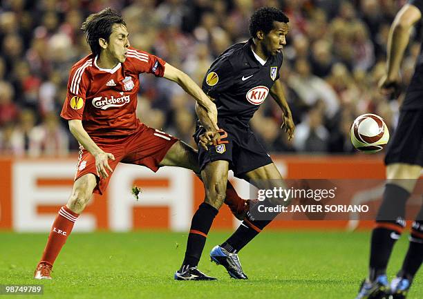 Atletico Madrid's Brazilian midfielder Paulo Assuncao vies with Liverpool's Israeli midfielder Yossi Benayoun during their UEFA Europa League...