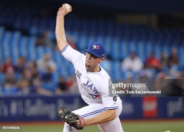 Tyler Clippard of the Toronto Blue Jays delivers a pitch in the ninth inning during MLB game action against the Detroit Tigers at Rogers Centre on...